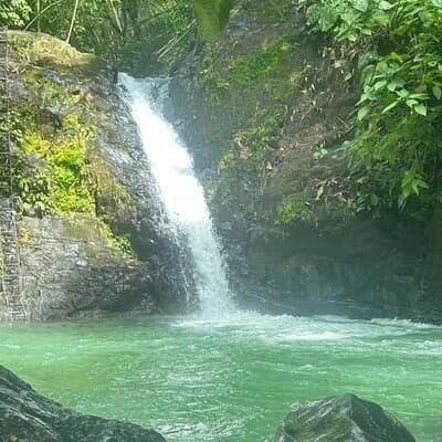 Uvita Waterfall, cliff jumping and water slide tobaggon.