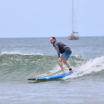 Surfing with Locals at Tamarindo Beach photo 3
